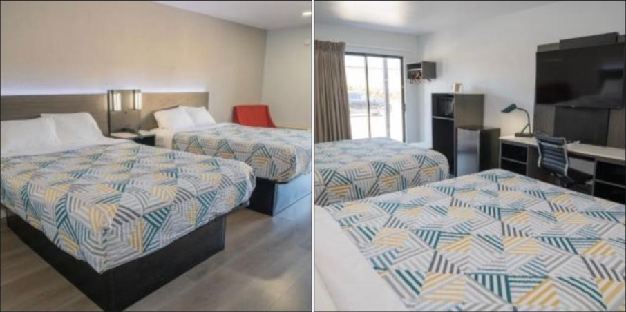 Hotel room with two beds and workspace